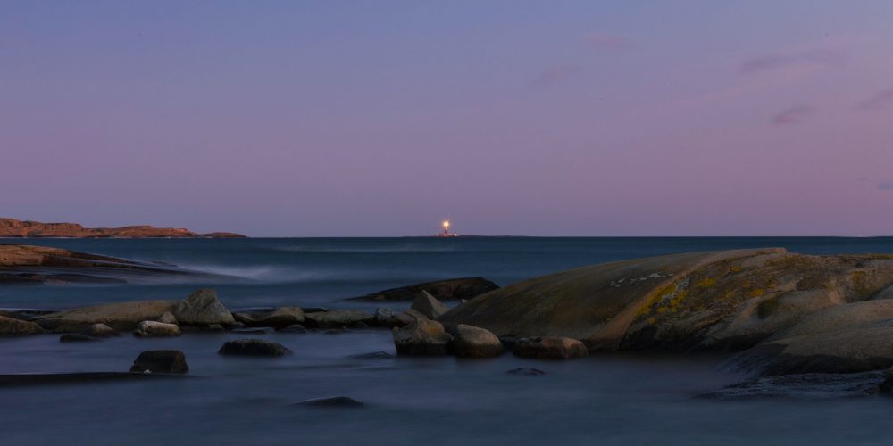 photo-of-body-of-water-with-boulders-2599783